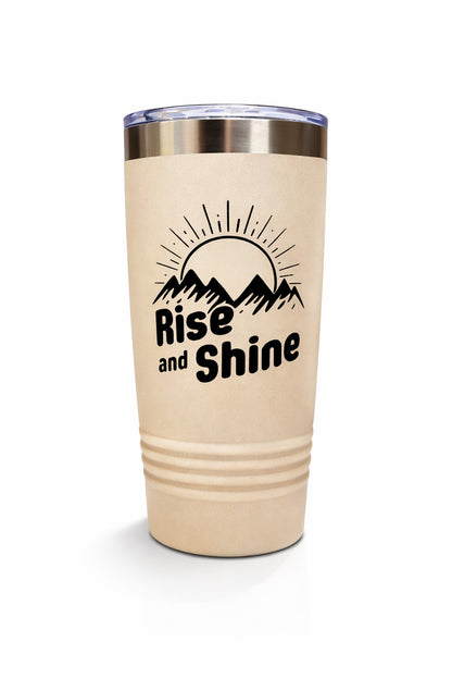 Beige tumbler with 'Rise and Shine' and mountain design on a white background